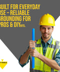 Worker holding a heavy duty sliding ground rod with handle for outdoor grounding systems, professional soil tool from T and T Tools.