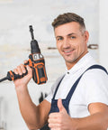 Man holding a drill with 3/8 Impact Adapter, 4 Pack Socket Adapter 1/4 Inch to 3/8 Socket Adapter Kit for Impact Driver in workshop