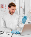 Man wearing Disposable Lab Coats For Adults Medium Pack Of 10 White Knee Length With Knit Collar Cuffs Plastic Snaps And 3 Pockets 50 GSM SMS
