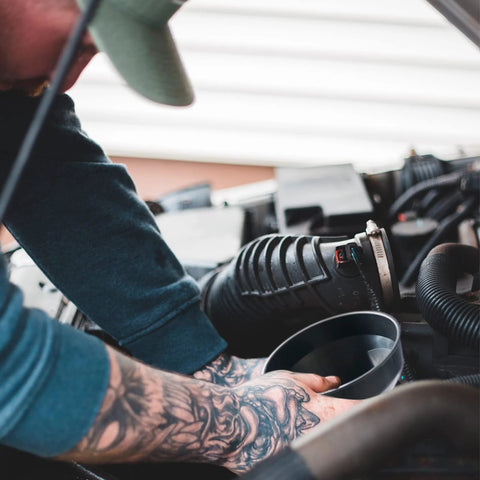 Person using Set Of 5 Plastic Oil Funnels With Long Hose For Automotive Fluid Transfers under car hood