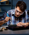Man using Pro Heat Set Soldering Tips Kit for Easy Heat Set Inserts in 3D Printing with a soldering iron and safety glasses