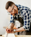 Craftsman wearing slip on safety glasses side shields 2 pairs transparent anti slip protectors in a workshop