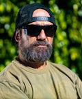 Man wearing Unisex Safety Glasses With Matte Black Frame And Removable Side Shields Z87 outdoors
