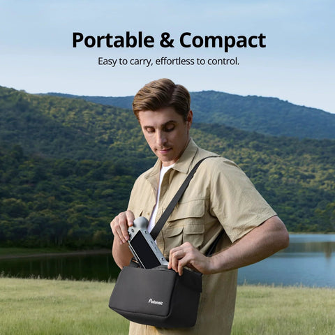 Man holding PTD 1 Remote Controller With 5.5-Inch 1080P Full HD Touch Display 10KM Transmission, outdoors with bag.