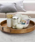 18 inch mango wood lazy susan serving tray with cups and condiments on a table, round rotating centerpiece for dining.