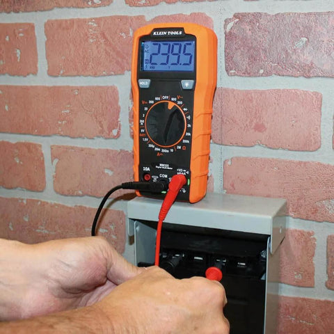 Multimeter, Digital Manual-Ranging 600V AC/DC Voltage Tester, measuring voltage on electrical box.