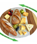13 Inch Marble And Acacia Wood Lazy Susan Rotating Serving Tray with cheese and bread, showing 360-degree rotation for dining tables.