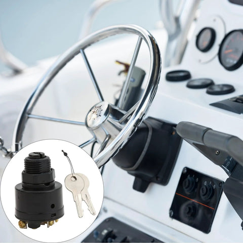 Marine ignition switch with two keys; black ABS plastic, installed on boat console near steering wheel.