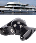 Door stopper magnet, marine-grade stainless steel, black finish; yacht in background.