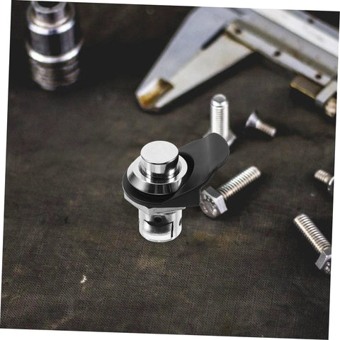 Close-up of chrome push-button latch with black mounting arm for cabinets or boats.