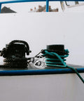 Holibanna stainless steel cam cleat on boat deck with two rope coils black and teal