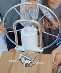 Stainless steel cam cleat with dual jaws, mirror-polished marine deck hardware on a wooden surface