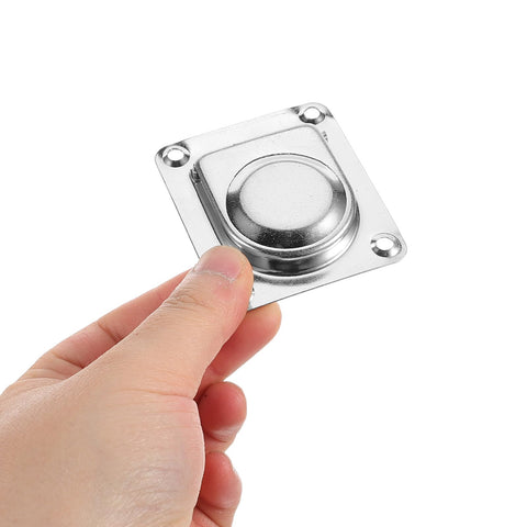 Stainless steel flush pull handle on square mounting plate (65x56mm) with four screw holes, held by hand.