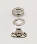 Front view: Turn-button eyelet and stud fastener set in silver; includes base plate, washer, and circular mounting ring