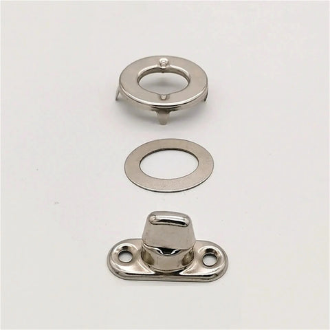 Front view: Turn-button eyelet and stud fastener set in silver; includes base plate, washer, and circular mounting ring