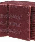 Stacked Maroon General Purpose Hand Pads 6x9 Perforated Nonwoven Abrasive Pack of 20