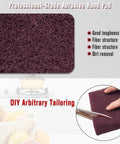 Maroon General Purpose Scrub Pad 6x9 Inches 20 Pack For Paint Prep And Scuffing cut with scissors, highlighting fiber structure.