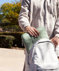 Matcha Green Puffy Nylon Laptop Sleeve With Zipper Medium 13 Inch Case Fits Up To 14 Inch Laptops being placed in backpack