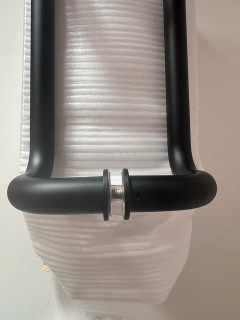 Stainless Steel 12 Inch Offset Door Pull Handle Matte Black Through Bolt Mounting shown from top view on foam padding