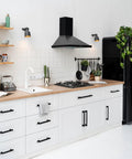 Matte Black Cabinet Handles 5 Inch 128mm Hole Centers Solid Zinc Alloy Drawer Pulls installed in white kitchen cabinets.