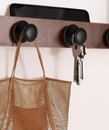 Image of 8 Pack Matte Black Self Adhesive Cabinet Knobs Set used to hang keys and a bag on a wooden rack.