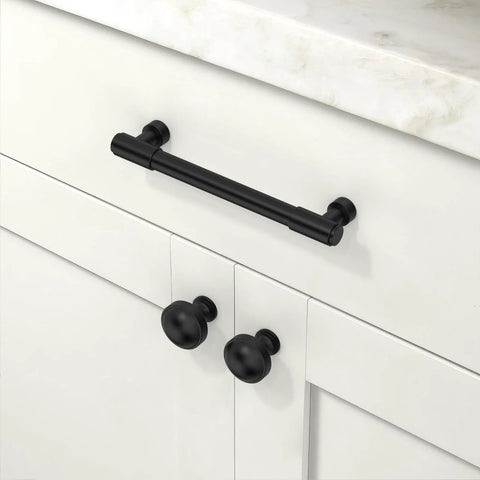10 Pack Matte Black Kitchen Cabinet Knobs 1 1/5 Inch 30mm Cabinet Pulls on white cabinet, showcasing modern zinc alloy design.