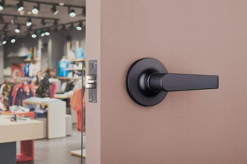 Brinks Commercial 4 Pack Light Duty Keyed Door Entry Storeroom Lever Matte Black installed on commercial door