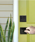 Hand using Matte Black 3 Pack Exterior Door Lock Set With Deadbolt And Front Door Handle Set Keyed Alike on yellow door