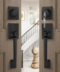 Matte Black Double Front Door Lock Set With Reversible Lever Handle And Dummy Exterior installed on wooden double doors.