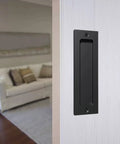 Flush Sliding Barn Door Handle Heavy Duty Finger Pull With Rectangular Plate Matte Black Finish Ideal For Sliding Barn Doors Cabinets Closets And Drawers No Sharp Edges Smooth Operation Durable Rust Resistant Construction One Piece Eight Point Six Six installed on a white door