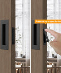 Matte Black Stainless Steel Pocket Door Pull And Edge Pull Set for recessed sliding doors, shown on wooden door frame.