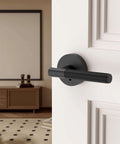 Matte black privacy door handle with lock on a white interior door, part of a 4 pack for bedrooms or bathrooms, reversible and keyless.