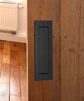 Flush Sliding Barn Door Handle Heavy Duty Finger Pull With Rectangular Plate Matte Black Finish on wooden door