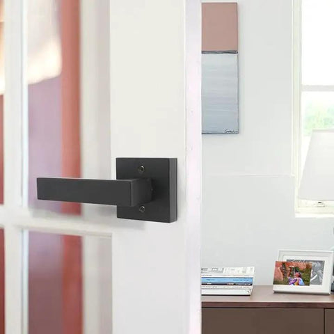 Matte Black Square Dummy Door Levers 4 Pack For French Doors And Closet Hardware installed on a white interior door.
