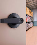 Brinks Commercial 4 Pack Light Duty Keyed Door Entry Storeroom Lever Matte Black installed on storeroom door