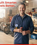 LeLuv Maxi Vacuum Pump front view; manual hand pump with gauge held by a man in a workshop
