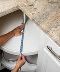 Installing 30-inch Premium Circular Lazy Susan Shelf Liner Kit for Kitchen Cabinets, showing non-slip white surface and fit around dishes