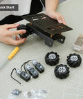 Person assembling Mecanum Wheel Robot Chassis Kit With 360 Degree Omnidirectional Wheels Aluminum Alloy Frame TT Motors 66mm