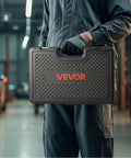 Mechanic holding a carrying case containing a 36 Piece Pull And Press Sleeve Kit With Carrying Case For Removing And Installing Bushings Bearings And Seals Compatible With Cars LCVs And HGV Engines Durable Steel Spindles For Professional Workshop Use