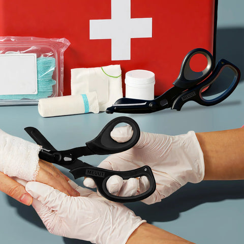 2 Pack Medical Trauma Shears For Left And Right Hand with Patented Bandage Scissors shown cutting bandage with first aid kit