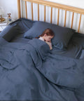 Child sleeping with Memory Foam Toddler Bed Rail Bumper For All Bed Sizes With Non Slip Machine Washable Cover Safe Anti Fall Guard Rail Queen King Twin Full Size Bed Guard Protection For Child Sleep on a bed