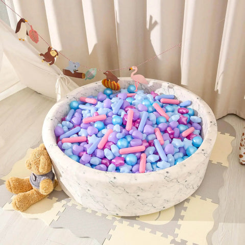 Ball Pit Balls - Pack of 200pcs Crush Proof Plastic Children's Toy Balls Mermaid Ocean Balls for Birthday Party Christmas Water Toy Indoor Outdoor,4 Shapes in a white pit with a teddy bear beside it.