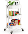 Three Tier Mesh Rolling Utility Cart With Handle And Lockable Wheels For Kitchen Office And Living Room White Finish Pipishell Metal Storage Cart With Versatile Shelves For Easy Organization displaying plants, books, and snacks