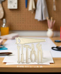 Versatile Die Cut Set For DIY Card Making And Scrapbooking With Intricate Metal Cutting Dies of tool shapes on crafting table