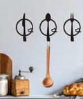 Three-Piece Knife, Fork and Spoon Kitchen Hook - Metal Wall Hanging, decor with wooden board and bread, practical kitchen artwork.