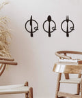 Three-Piece Knife, Fork and Spoon Kitchen Hook - Metal Wall Hanging in a modern dining area, decorative and functional wall art