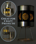 Craft project using empty quart paint cans with lids, unlined metal, showing decorative light holes, crafted with metal stand.