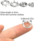 Close-up of metal snap showing claw length and size for Must Have Snap Button Kit With Five Claw Buckle Pliers For Clothing Leather Crafting And Sewing, 100 Sets Metal Snaps, Snap Fastener Tool Set, Durable Prong Snaps For Easy Garment Upgrades Abruga.