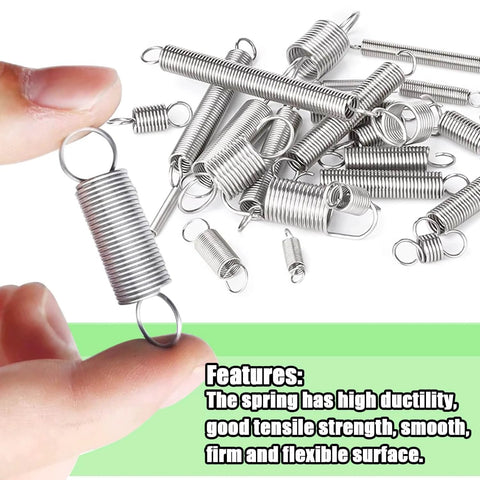 Close-up view of a person holding a metal spring coil with more springs scattered in the background, featuring high ductility and tensile strength.