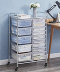 Metal storage cart with multiple drawers on caster wheels near a desk with a lamp.